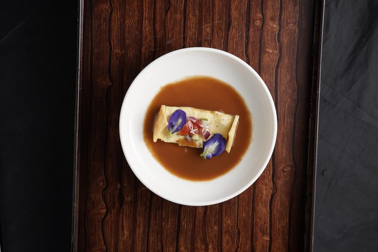 Mgbe oyster omelette and fried yam in prawn head bisque